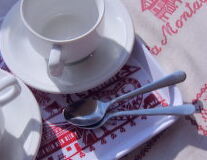 a close up of a coffee cup on a plate